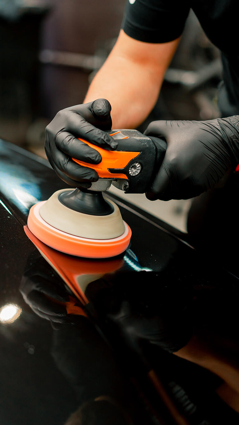 At detailing machine polishing service Black car getting machine polished by AT detailing