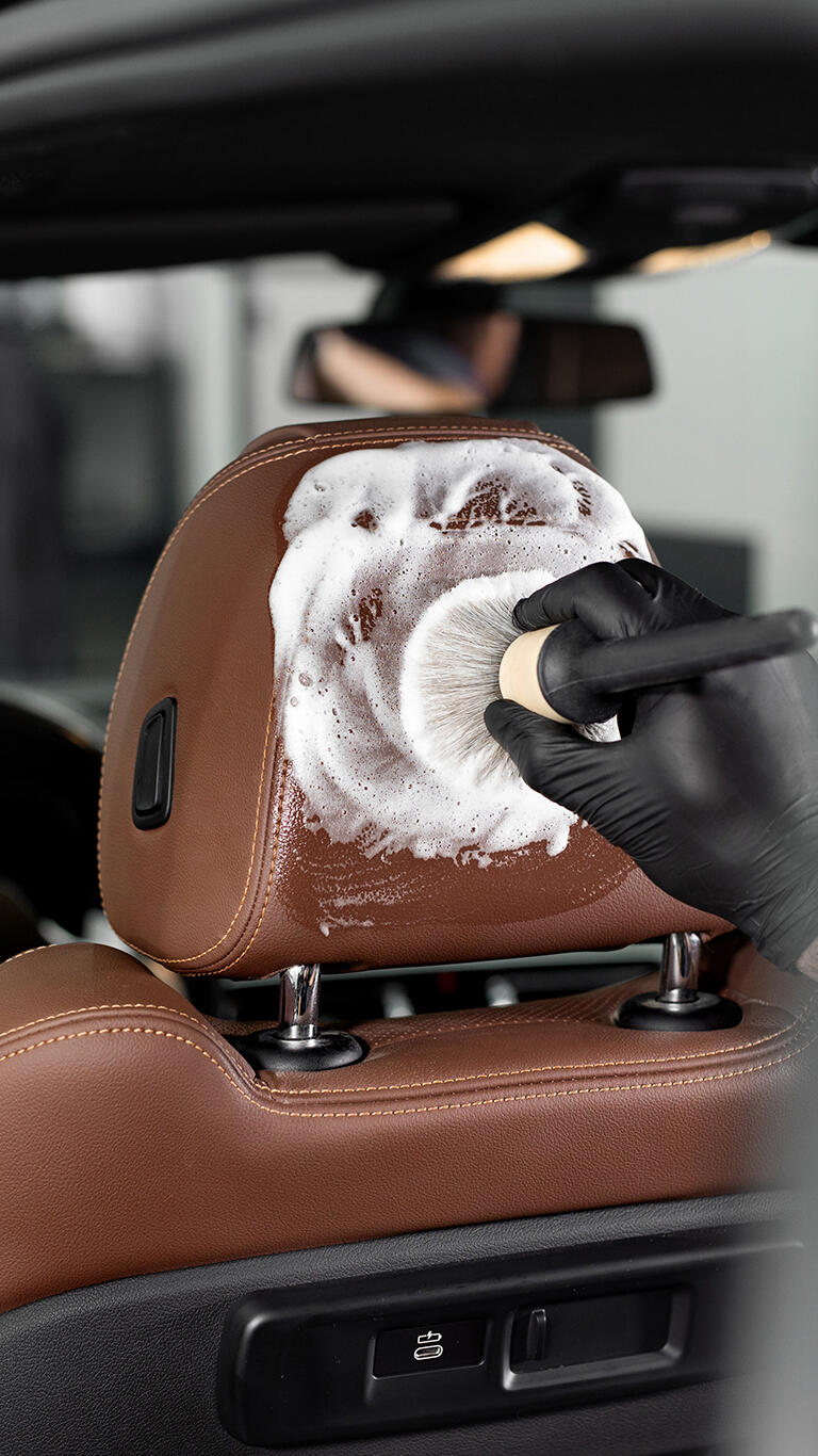 AT detailing premium service Tan Leather getting cleaned by AT detailing